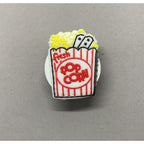 Suport adeziv pliabil pentru telefon, cu figurină, popcorn